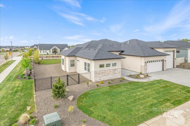 6201 W Redland Dr, Eagle, ID 83616 - view of front of property with driveway, a garage, fence, stone siding, and stucco siding