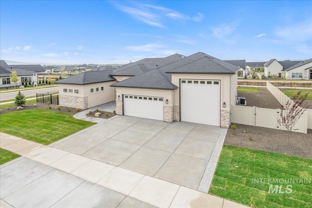 6201 W Redland Dr, Eagle, ID 83616 - ranch-style house with a residential view, stone siding, a garage, a front yard, and a gate