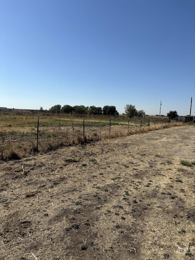 view of yard with a rural view