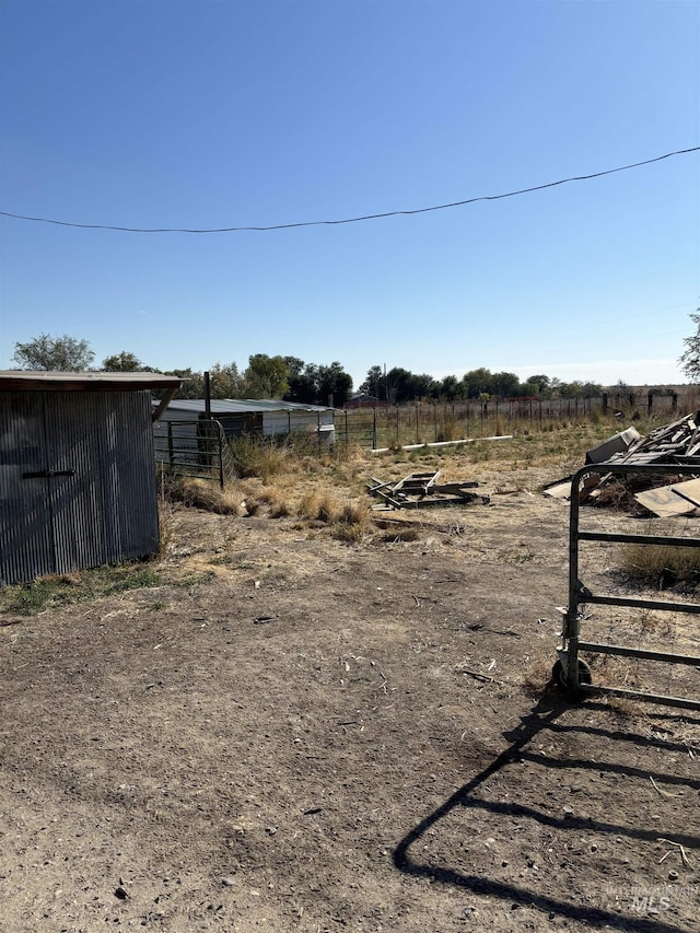 view of yard with a rural view