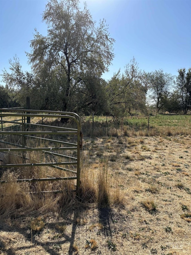 view of gate featuring a rural view