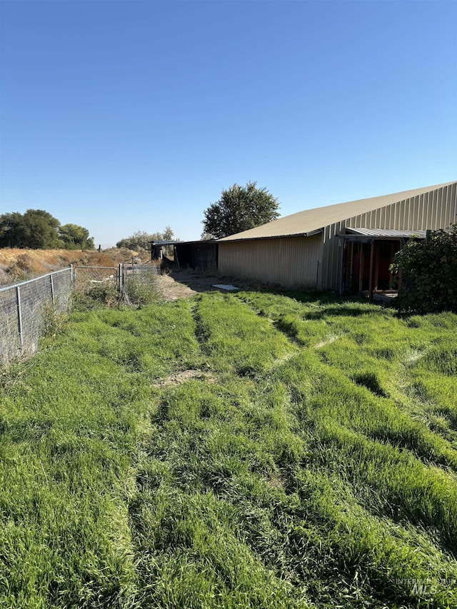 view of yard with a rural view