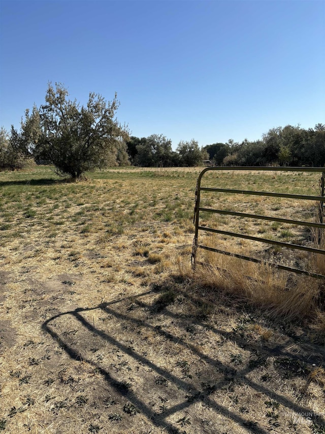 view of gate featuring a rural view