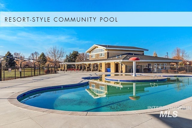 pool featuring a patio area and fence