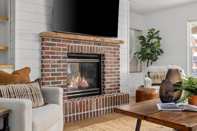 interior space with wood finished floors and a fireplace