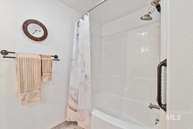 full bathroom with shower / tub combo with curtain