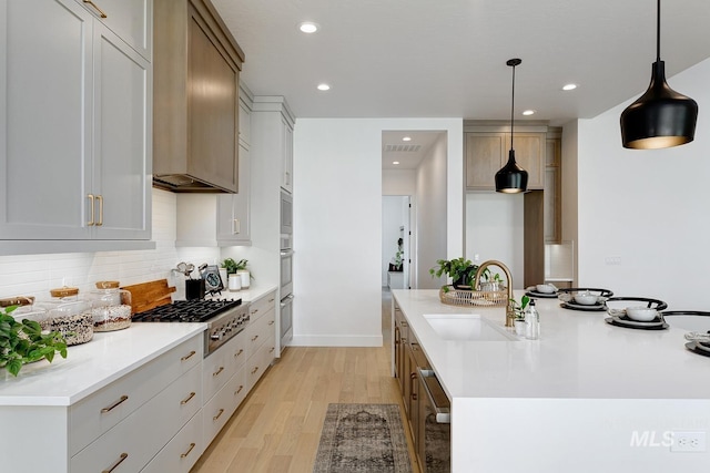 kitchen featuring recessed lighting, a sink, visible vents, backsplash, and appliances with stainless steel finishes