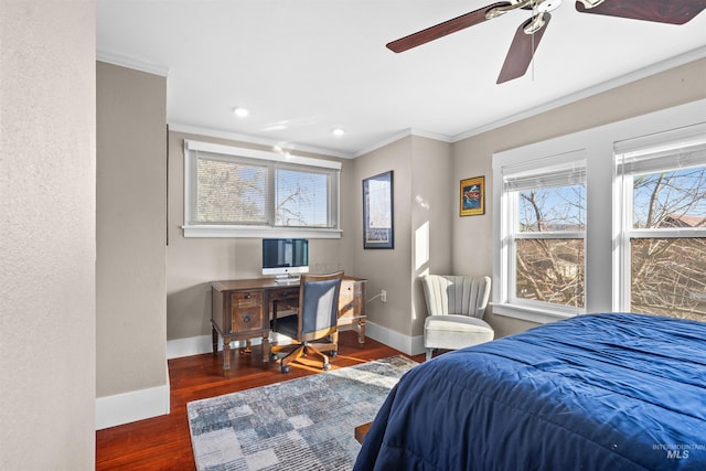 bedroom featuring ornamental molding, baseboards, and wood finished floors