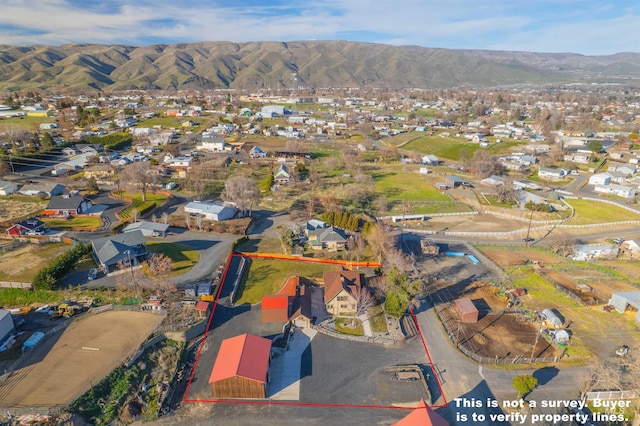 birds eye view of property featuring a residential view and a mountain view