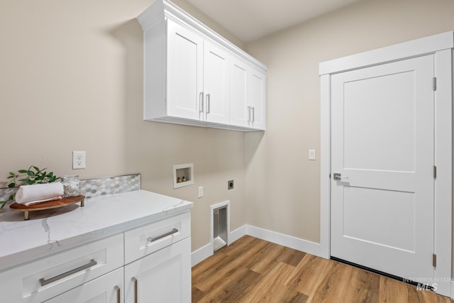 1785 E Grayson, Meridian, ID 83642 - washroom featuring cabinet space, electric dryer hookup, hookup for a washing machine, light wood-style floors, and baseboards