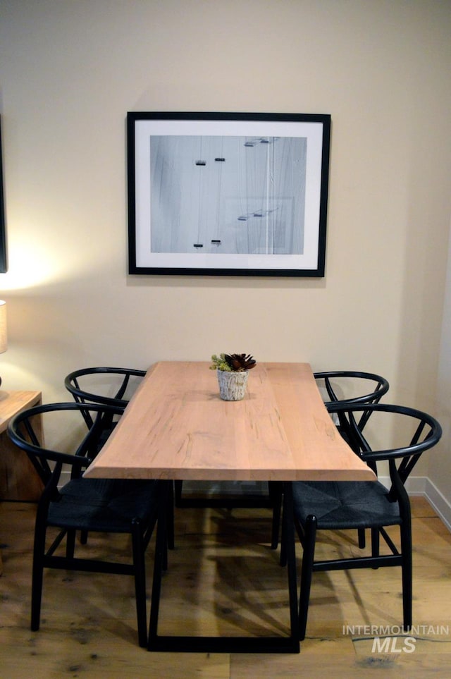 780 Village Dr Unit 308, Donnelly, ID 83615 - dining area featuring baseboards and wood finished floors