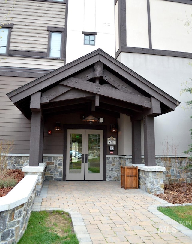 780 Village Dr Unit 308, Donnelly, ID 83615 - doorway to property featuring french doors and stone siding