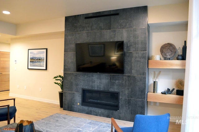780 Village Dr Unit 308, Donnelly, ID 83615 - living area with recessed lighting, baseboards, wood finished floors, and a fireplace