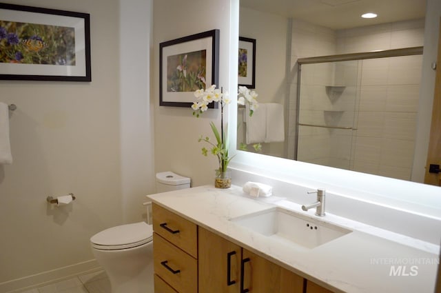 780 Village Dr Unit 308, Donnelly, ID 83615 - bathroom featuring tile patterned flooring, vanity, toilet, baseboards, and a stall shower