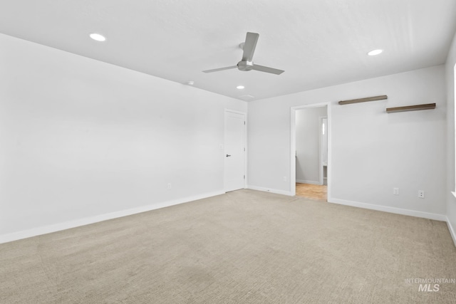 unfurnished bedroom with light carpet, recessed lighting, baseboards, and a ceiling fan