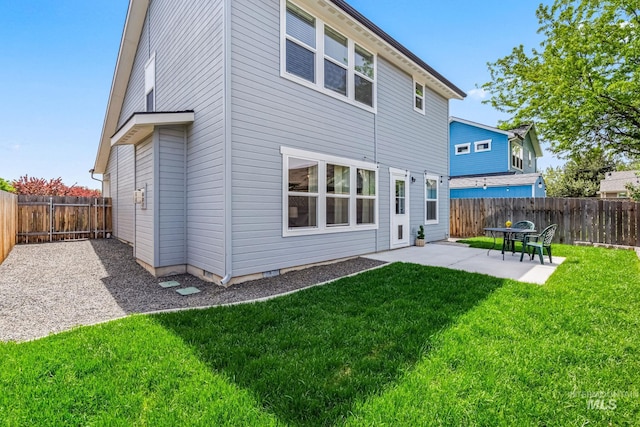 back of house with a patio