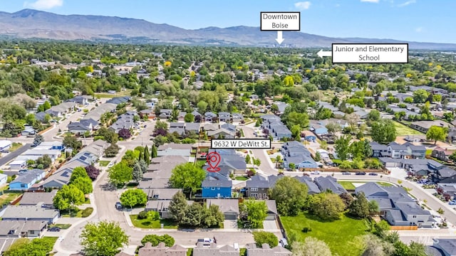aerial view of residential area featuring mountains