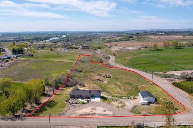 birds eye view of property featuring a rural view