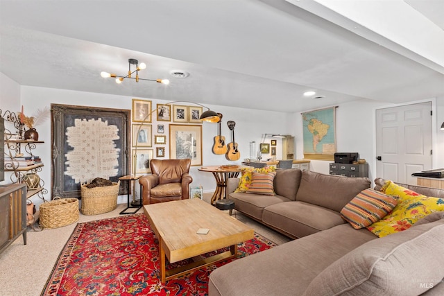 living area with an inviting chandelier, carpet floors, and visible vents