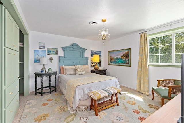 bedroom featuring baseboards, visible vents, light colored carpet, and a chandelier