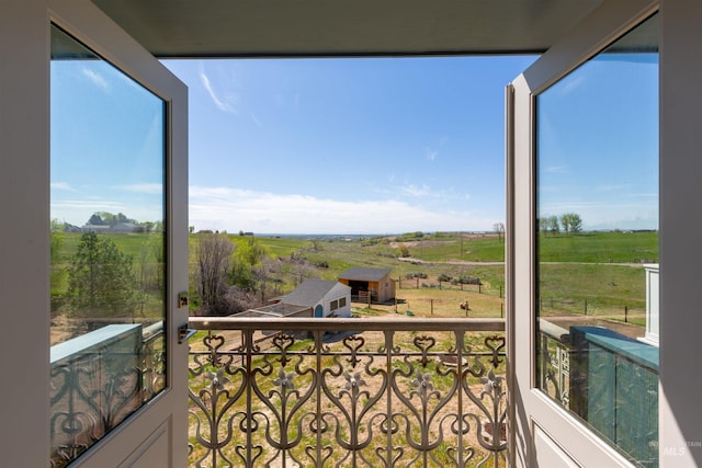 balcony featuring a rural view