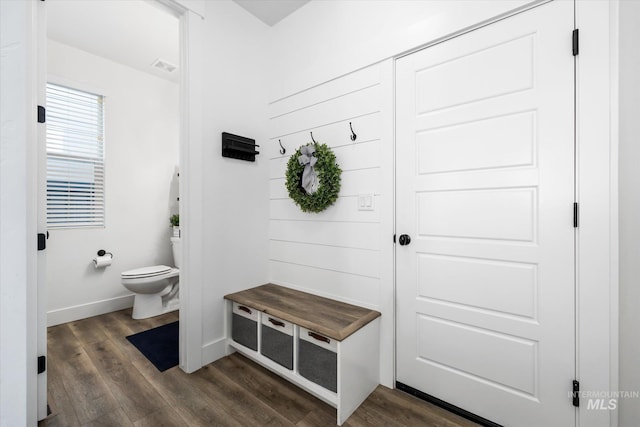 mudroom featuring visible vents, dark wood-style floors, and baseboards