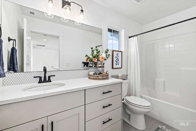 full bathroom featuring visible vents, toilet, backsplash, shower / tub combo, and vanity