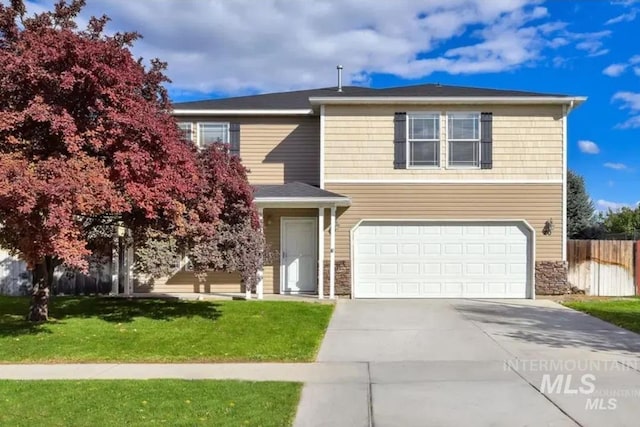 view of front facade with a front yard and a garage