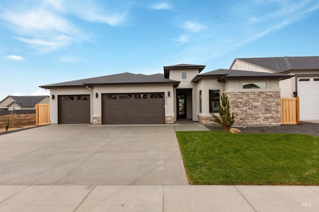 4329 N Madden Way, Meridian, ID 83646 - view of front of home featuring a garage and a front yard