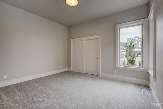 living room with light hardwood / wood-style floors, a wealth of natural light, ceiling fan, and a fireplace