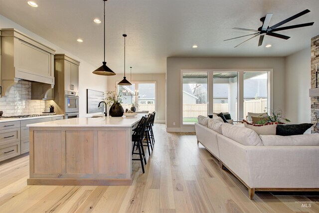 living room featuring a fireplace and ceiling fan