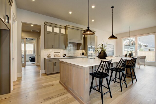 dining room featuring light wood-type flooring and a notable chandelier