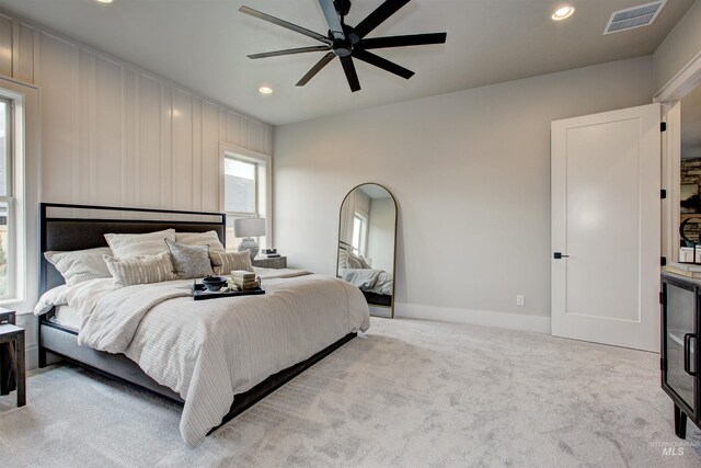 bathroom with tile patterned floors, vanity, and a bathing tub