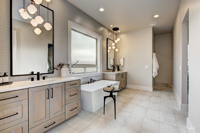 laundry area featuring washer hookup, gas dryer hookup, sink, hookup for an electric dryer, and cabinets