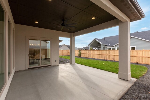 view of patio featuring ceiling fan