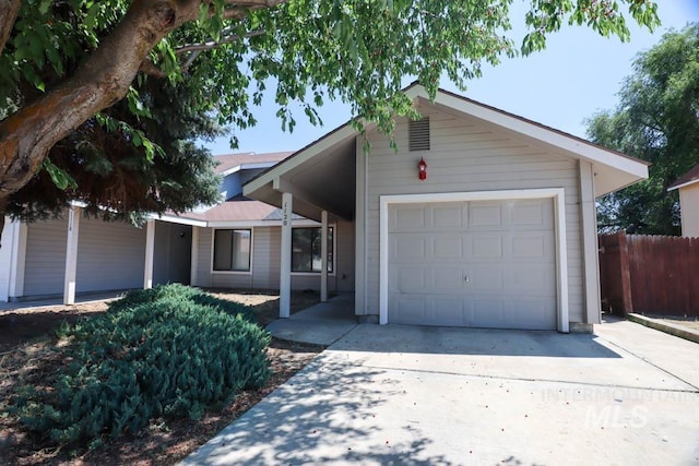 1120 SW 14th Ave, Ontario, OR 97914 - ranch-style home with an attached garage and concrete driveway