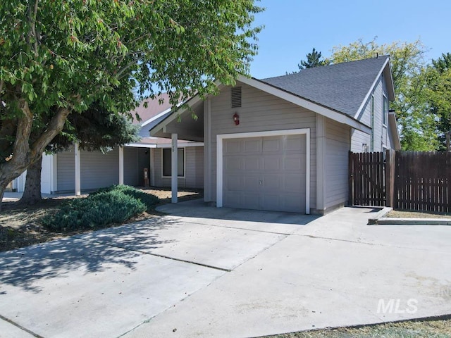 1120 SW 14th Ave, Ontario, OR 97914 - view of front of home with an attached garage, concrete driveway, and a shingled roof