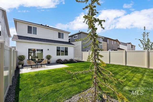rear view of property featuring a patio area