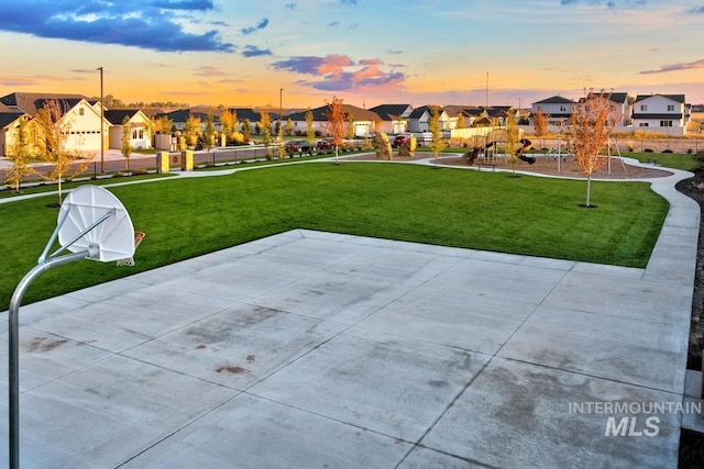view of property's community featuring a residential view and a yard