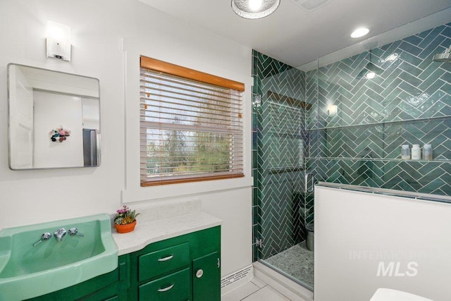 606 S Ridge Rd, Moscow, ID 83843 - full bathroom with walk in shower, vanity, tile patterned floors, recessed lighting, and toilet