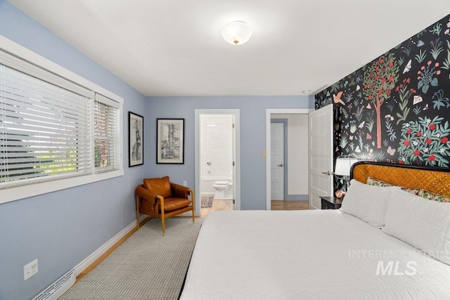 606 S Ridge Rd, Moscow, ID 83843 - carpeted bedroom with baseboards and ensuite bath