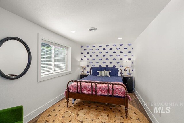 606 S Ridge Rd, Moscow, ID 83843 - bedroom with baseboards, wood finished floors, and recessed lighting
