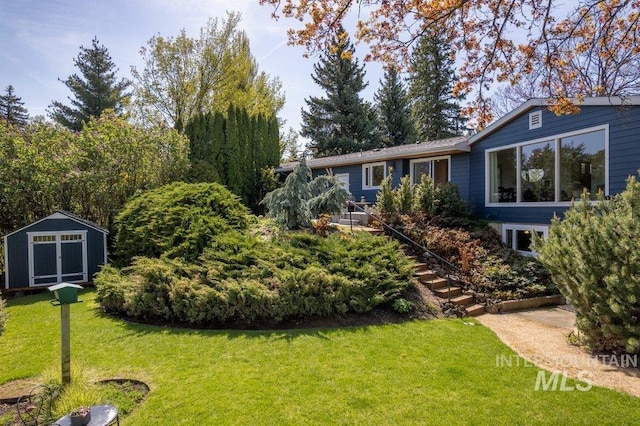 606 S Ridge Rd, Moscow, ID 83843 - view of green lawn with an outbuilding and stairs