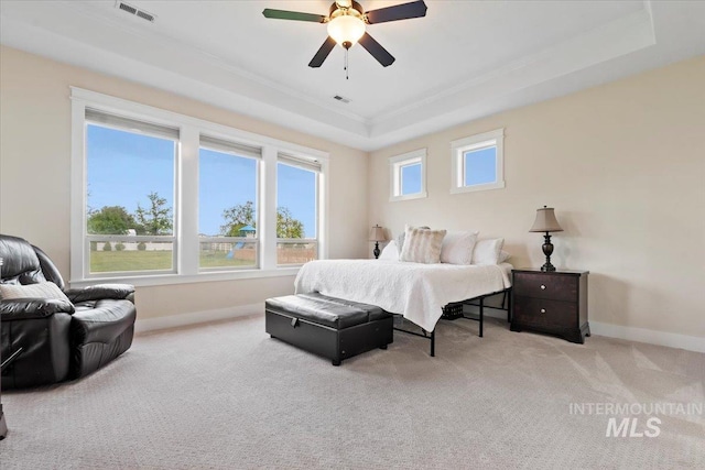 14942 Midway Rd, Nampa, ID 83651 - bedroom featuring a tray ceiling, crown molding, baseboards, carpet, and ceiling fan