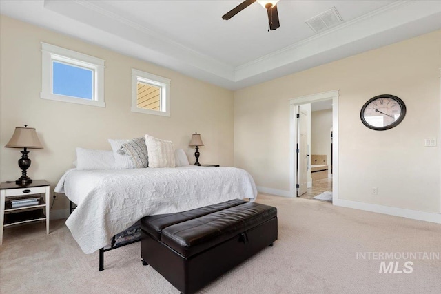 14942 Midway Rd, Nampa, ID 83651 - carpeted bedroom with ornamental molding, a tray ceiling, baseboards, ensuite bath, and ceiling fan