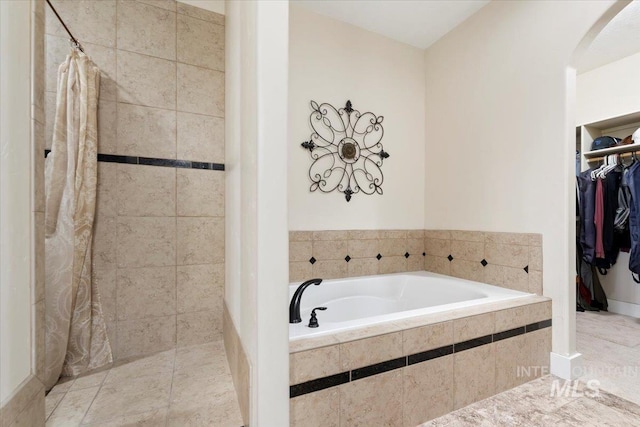 14942 Midway Rd, Nampa, ID 83651 - full bath featuring a bath, a tile shower, and a spacious closet