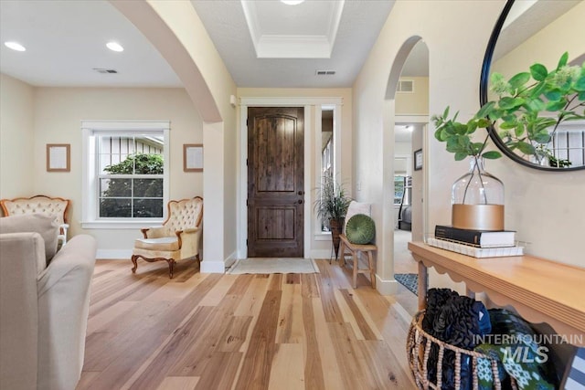 14942 Midway Rd, Nampa, ID 83651 - foyer featuring arched walkways, light wood finished floors, recessed lighting, and baseboards