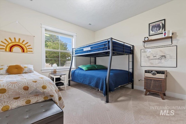 14942 Midway Rd, Nampa, ID 83651 - bedroom with light carpet, baseboards, and a textured ceiling
