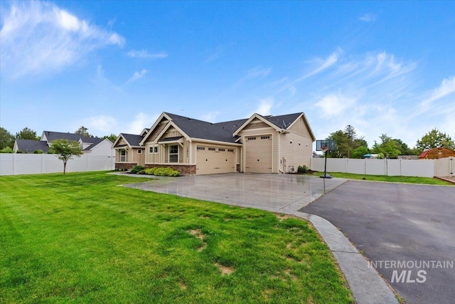14942 Midway Rd, Nampa, ID 83651 - view of front facade featuring concrete driveway, a garage, and stone siding