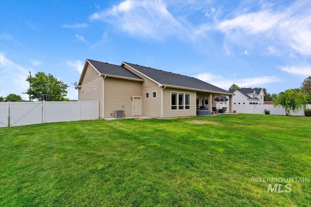 14942 Midway Rd, Nampa, ID 83651 - back of house with central air condition unit, board and batten siding, and a patio area